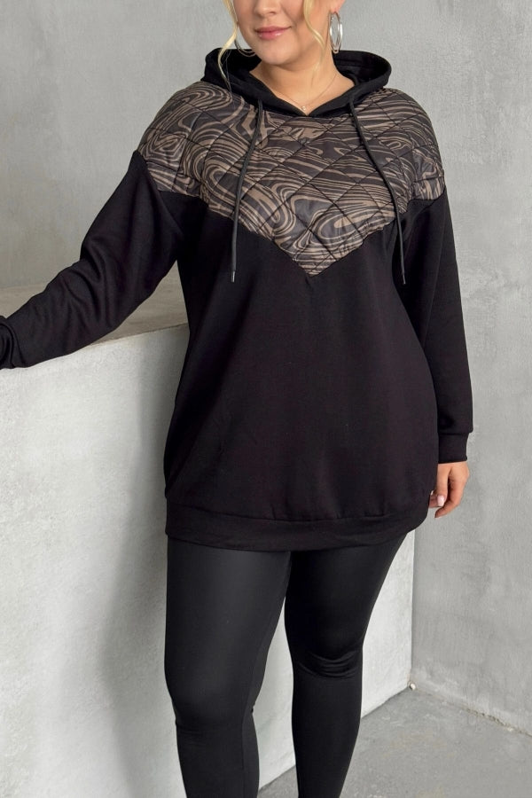 Kapitone dikişli siyah sweatshirt doku yakın çekim